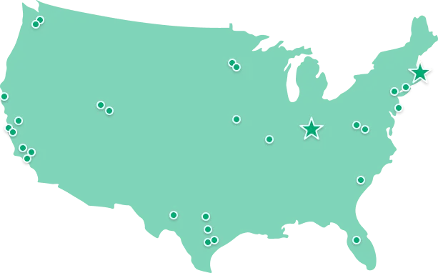 A simplified green map of the United States with multiple small white circles marking various locations and two larger star symbols highlighting locations in the Northeast and the Midwest.